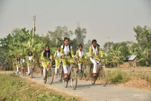 Bangla girl students riding a bicycle